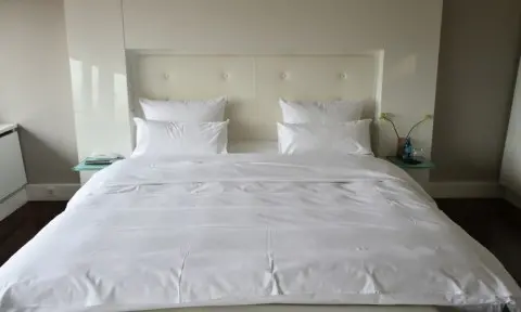 Clean and organized bedroom after professional house cleaning service